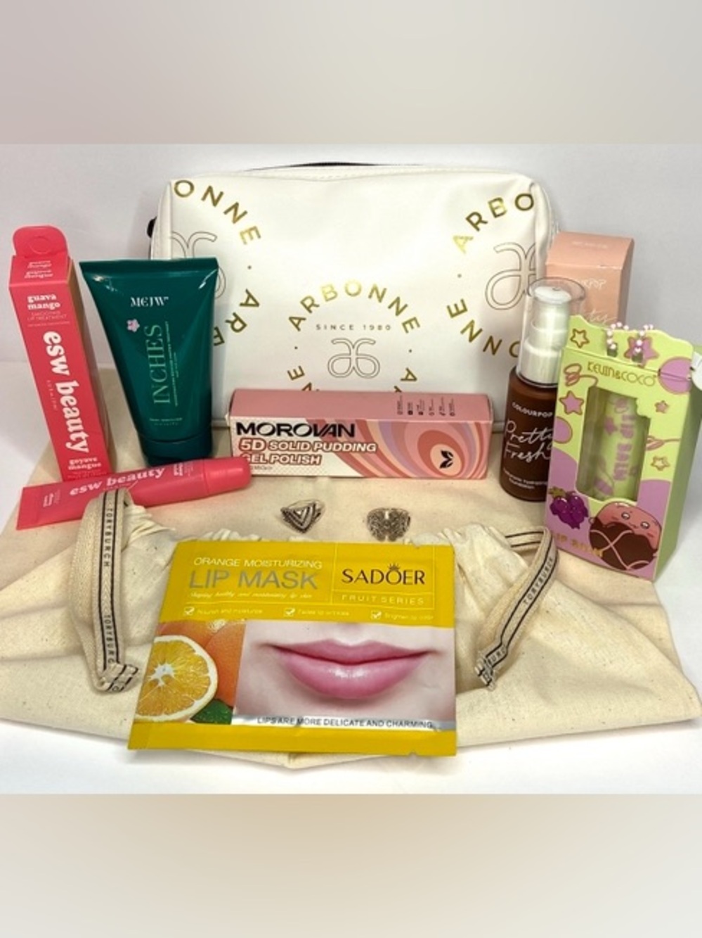 10 pcs total Arbonne White Cosmetic Pouch with Skincare  w Tory Burch dust bag